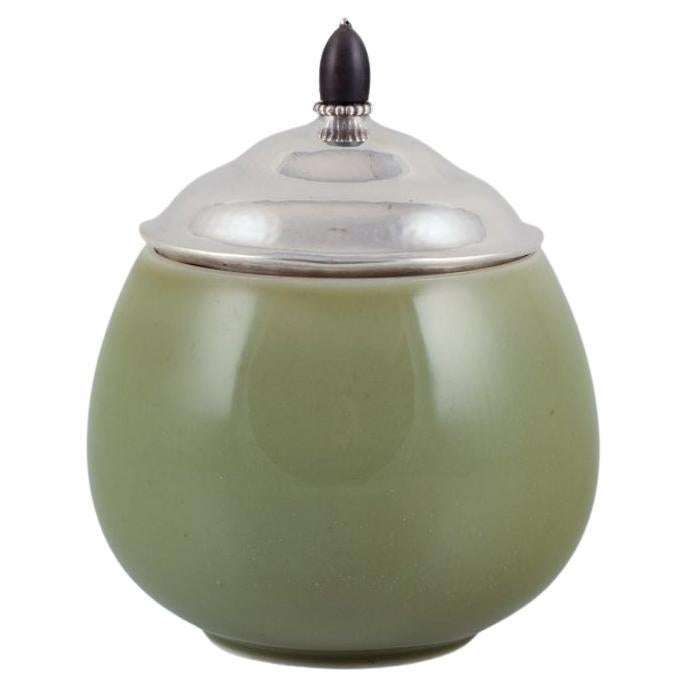 Royal Copenhagen ceramic jar. Silver lid with ebony knob. Celadon glaze.