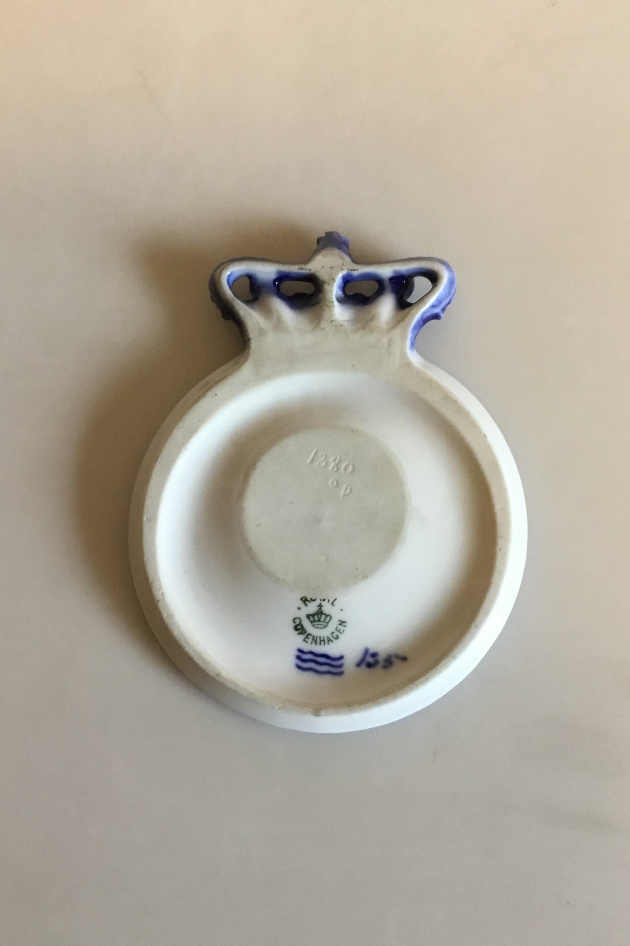 Royal Copenhagen Commemorative plate from 1912 RC-CM138. Measures 14 cm / 5 33/64 in. and is in perfect condition.

RC-CM138, 1912 Crowned commemorative plate for King Frederik VIII. Laurel wreath in the center face to face monogram F8 and the