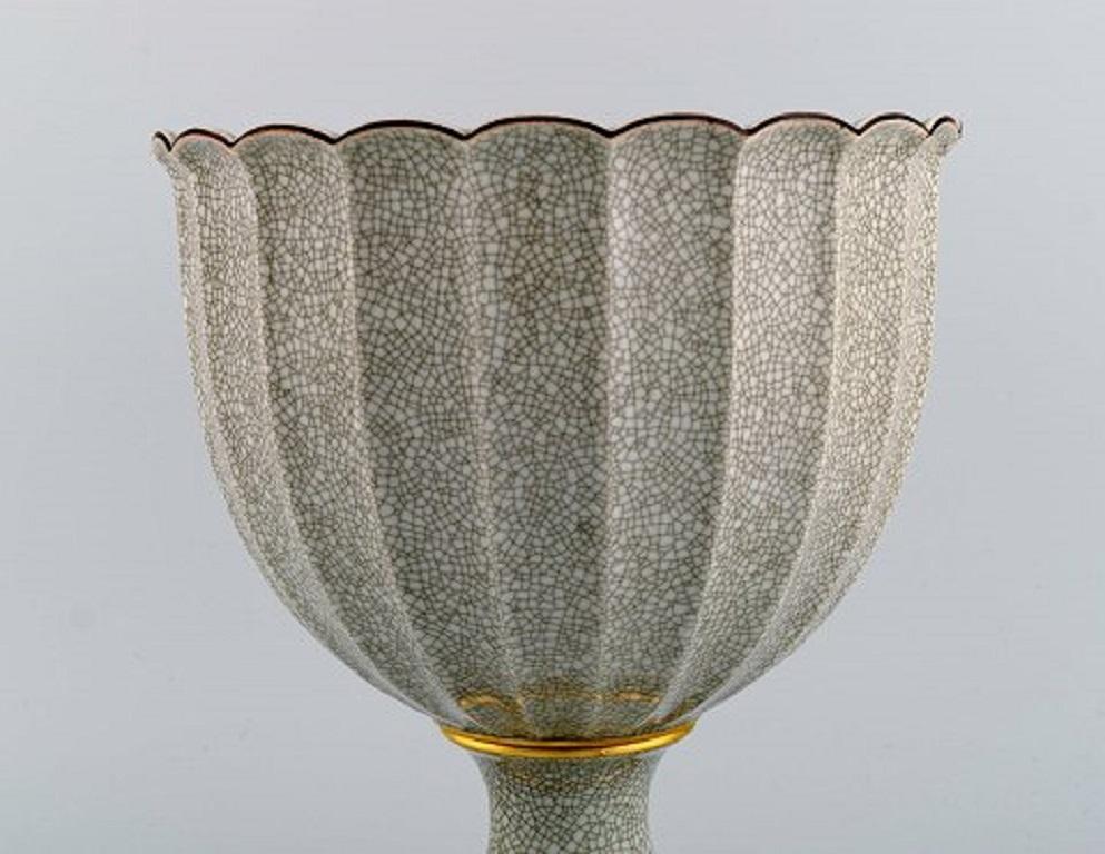 Royal Copenhagen crackle Art Deco vase with gold decoration. Rare form. 
Dated 1947.
Measures: 23 x 19 cm.
Stamped.
In excellent condition.