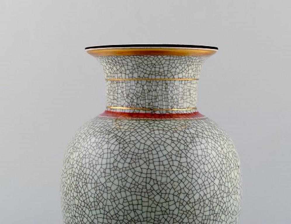 Royal Copenhagen crackled / craquelé vase in glazed ceramic, 1930s-1940s.
In very good condition.
Measures: 24 x 14.5 cm.
Stamped.