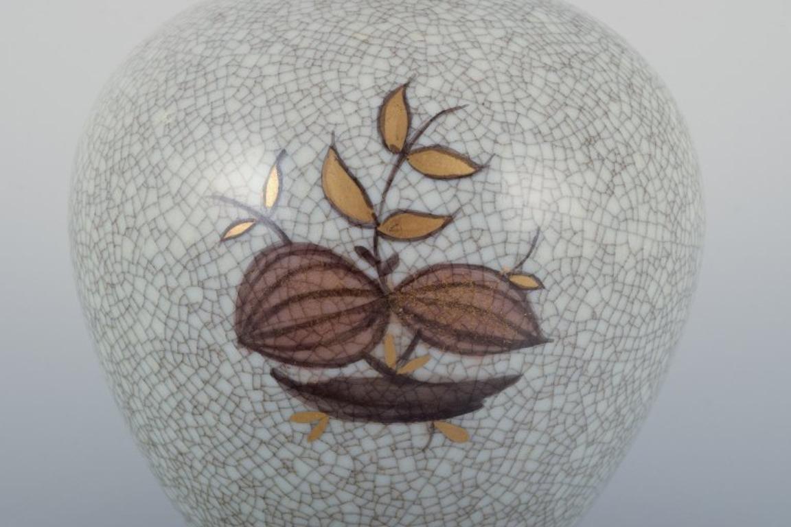 Danish Royal Copenhagen, crackled porcelain vase with floral motif and gold decoration. For Sale