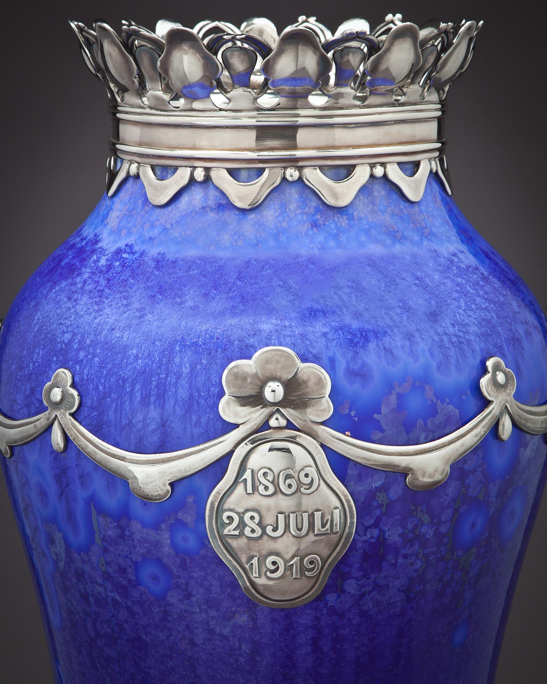 Royal Copenhagen crystalline vase, signed Valdemar Engelhardt, the silver was made by The Royal Silversmith Michaelson.

Presentation to Dowager Queen Louise, widow of King Frederick the 8th of Denmark, on the occasion of her 50th anniversary as a