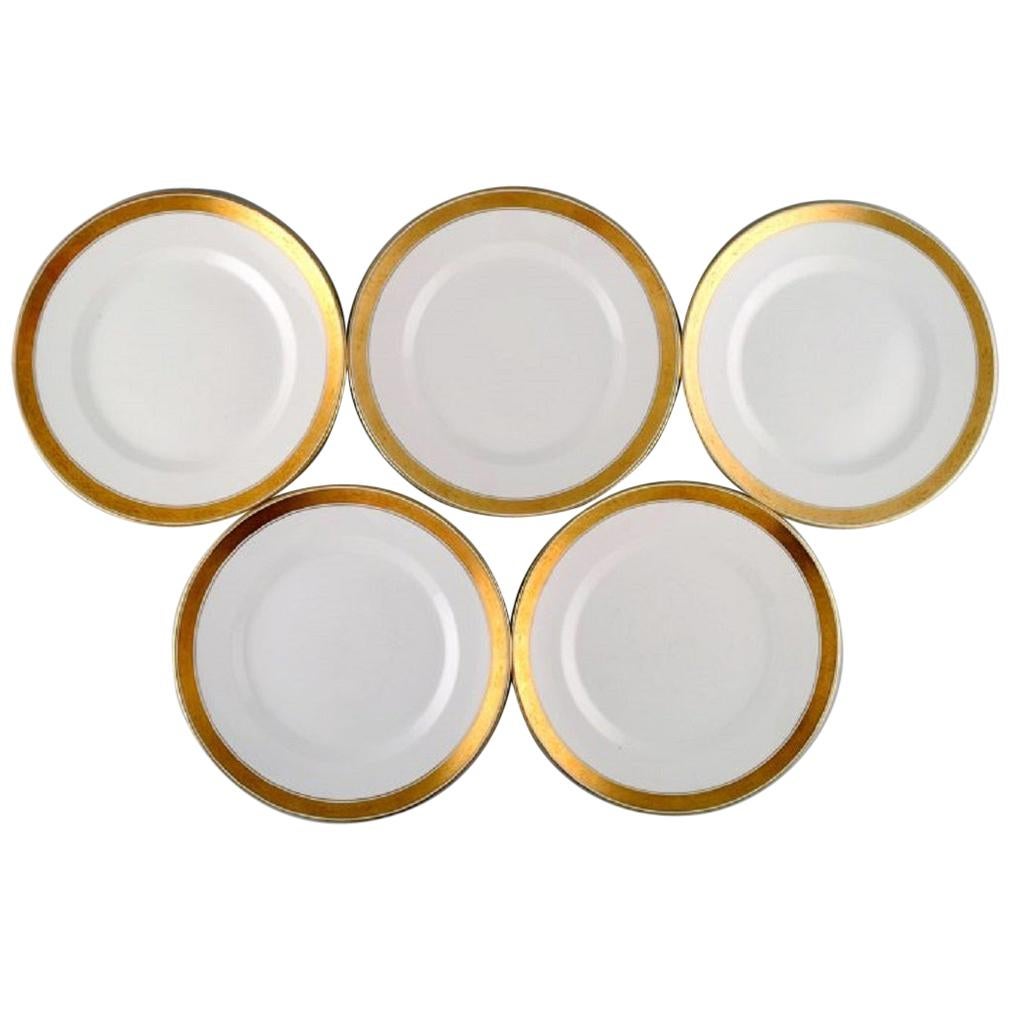 Royal Copenhagen Dagmar, White, Five Porcelain Dinner Plates with Gold Edge