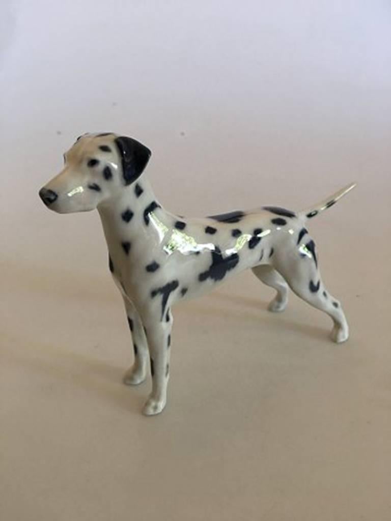 Royal Copenhagen Dalmatian dog figurine No. 3501. 1st quality in perfect condition. Measures: 12.5 cm H. 17 cm L.