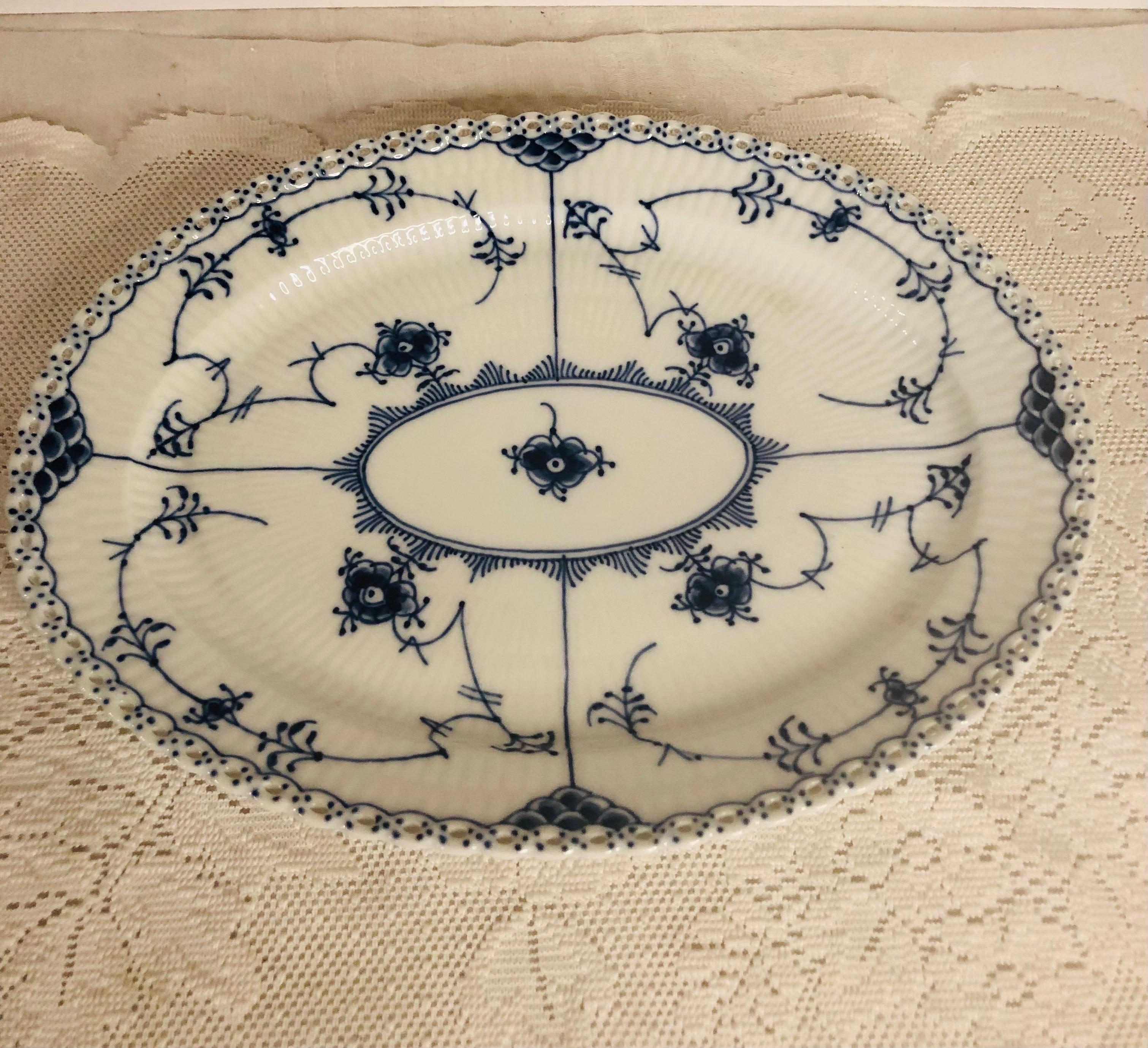 I want to offer you this fabulous Royal Copenhagen platter with full lace openwork design on the borders. This full lace fluted dinnerware was the first dinner service sold by Royal Copenhagen in 1775. In 1885, the artistic director of Royal