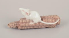 Royal Copenhagen, Denmark. Porcelain figurine of a mouse on a corn cob.