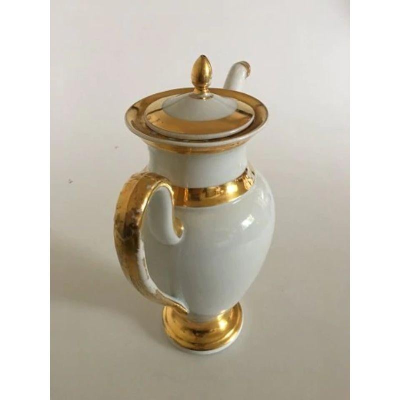 Royal Copenhagen Empire coffee pot from 1820-1850

In good condition, but has gold wear. Measures 27cm / 10 3/5
