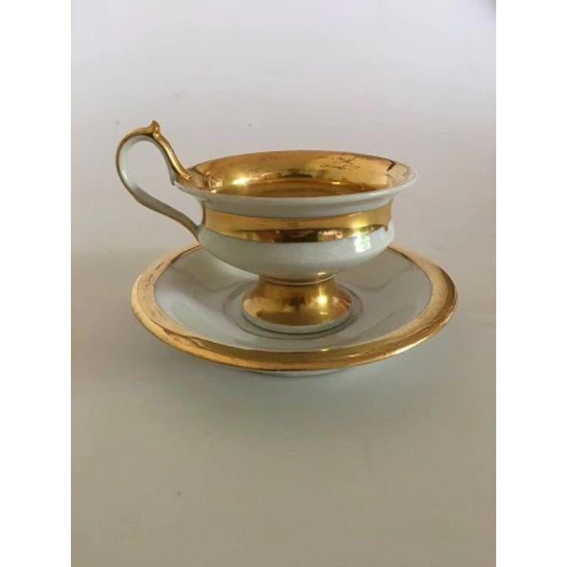 Royal Copenhagen Empire Cup and saucer from 1820-1850.

In good condition with light gold wear. The cup measures 8cm/ 3 1/7