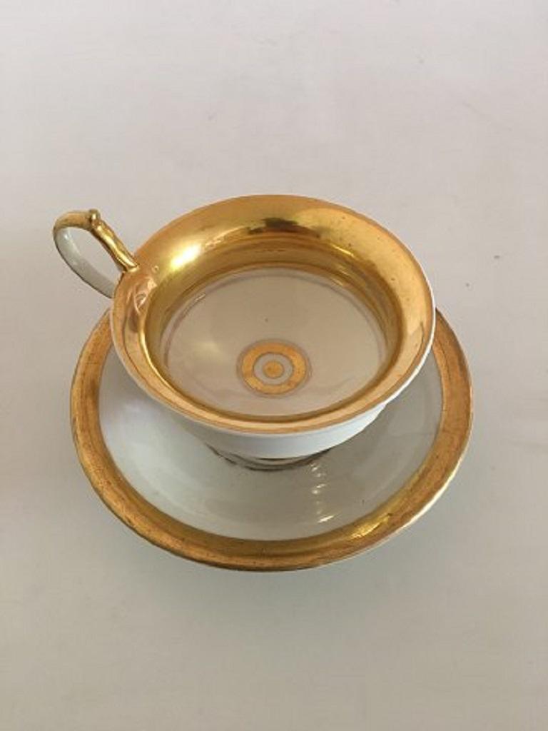 Royal Copenhagen Empire cup and saucer from 1820-1850

In good condition with light gold wear. The cup measures 8cm/ 3 1/7