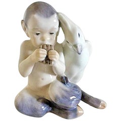 Un faune avec perroquet Royal Copenhagen n° 2424