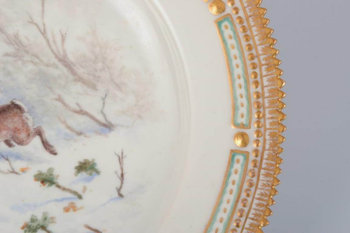 Early 20th Century Royal Copenhagen Fauna Danica dinner plate with a motif of a hare. For Sale
