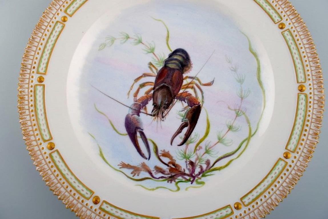 Royal Copenhagen Fauna Danica fish plate in hand-painted porcelain with a crayfish and gold decoration. 
Model number 19/3549. 
Dated 1965.
Diameter: 25.5 cm.
In excellent condition.
Stamped.
2nd factory quality.
