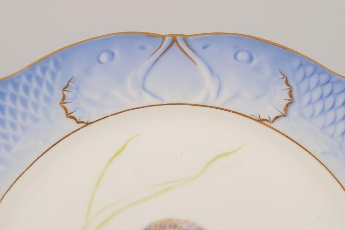 Hand-Painted Royal Copenhagen Fauna Danica porcelain plate with fish motif. Approx. 1930 For Sale