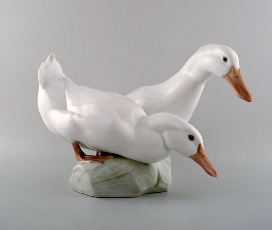 Royal Copenhagen. Figure group of porcelain, white ducks, no. 412.
C. F. Liisberg.
Measures: Height 16 cm, length 31 cm.
1st. Factory quality.
In perfect condition.