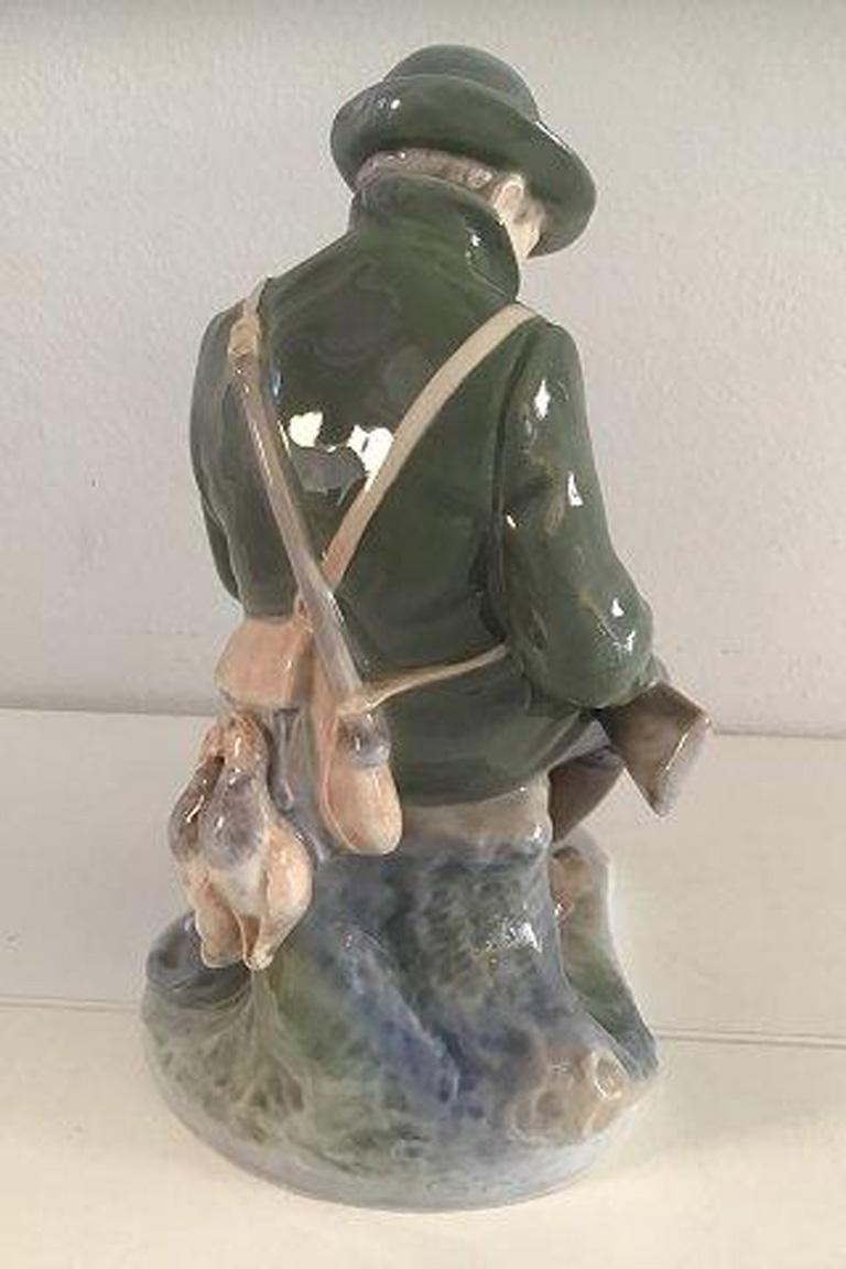 20th Century Royal Copenhagen Figurine Hunter with Dog No 1087 For Sale