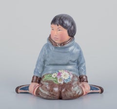 Royal Copenhagen, figurine of a Greenlandic boy with flowers, 1930s