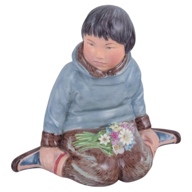 Royal Copenhagen, figurine of a Greenlandic boy with flowers, 1930s