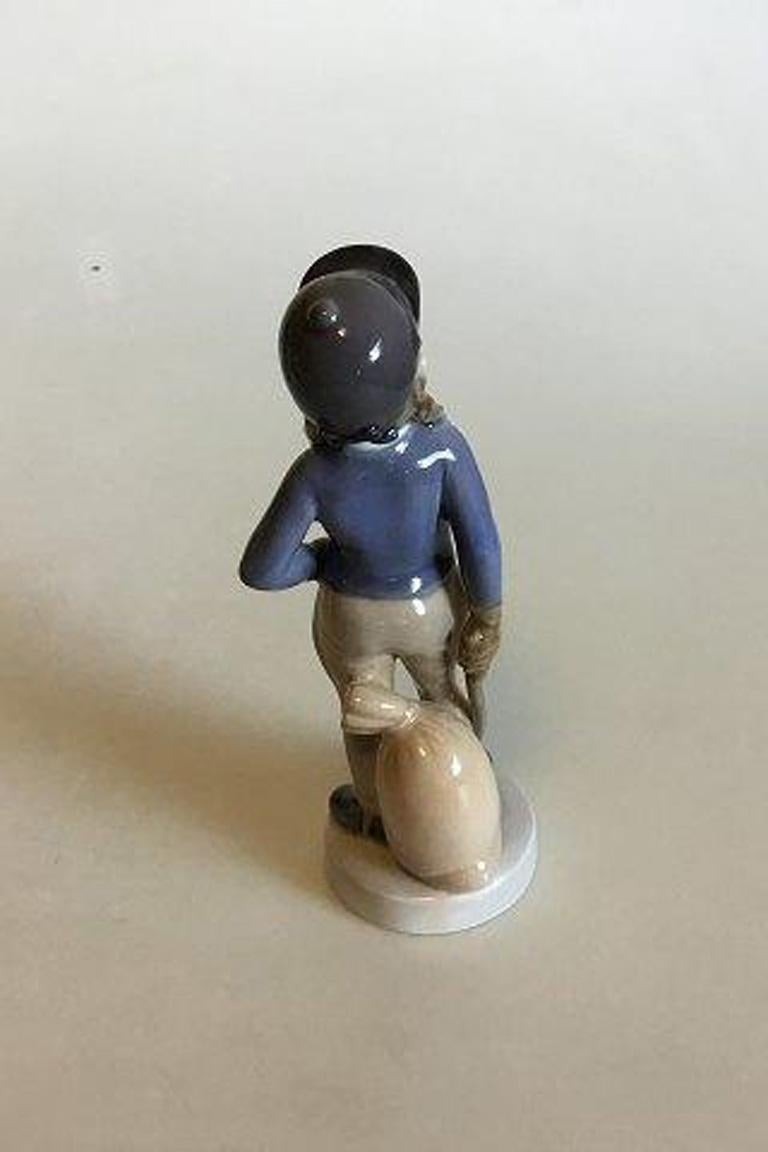Royal Copenhagen figurine of girl, November no 4533. 

Measures 18 cm 7 3/32 in.