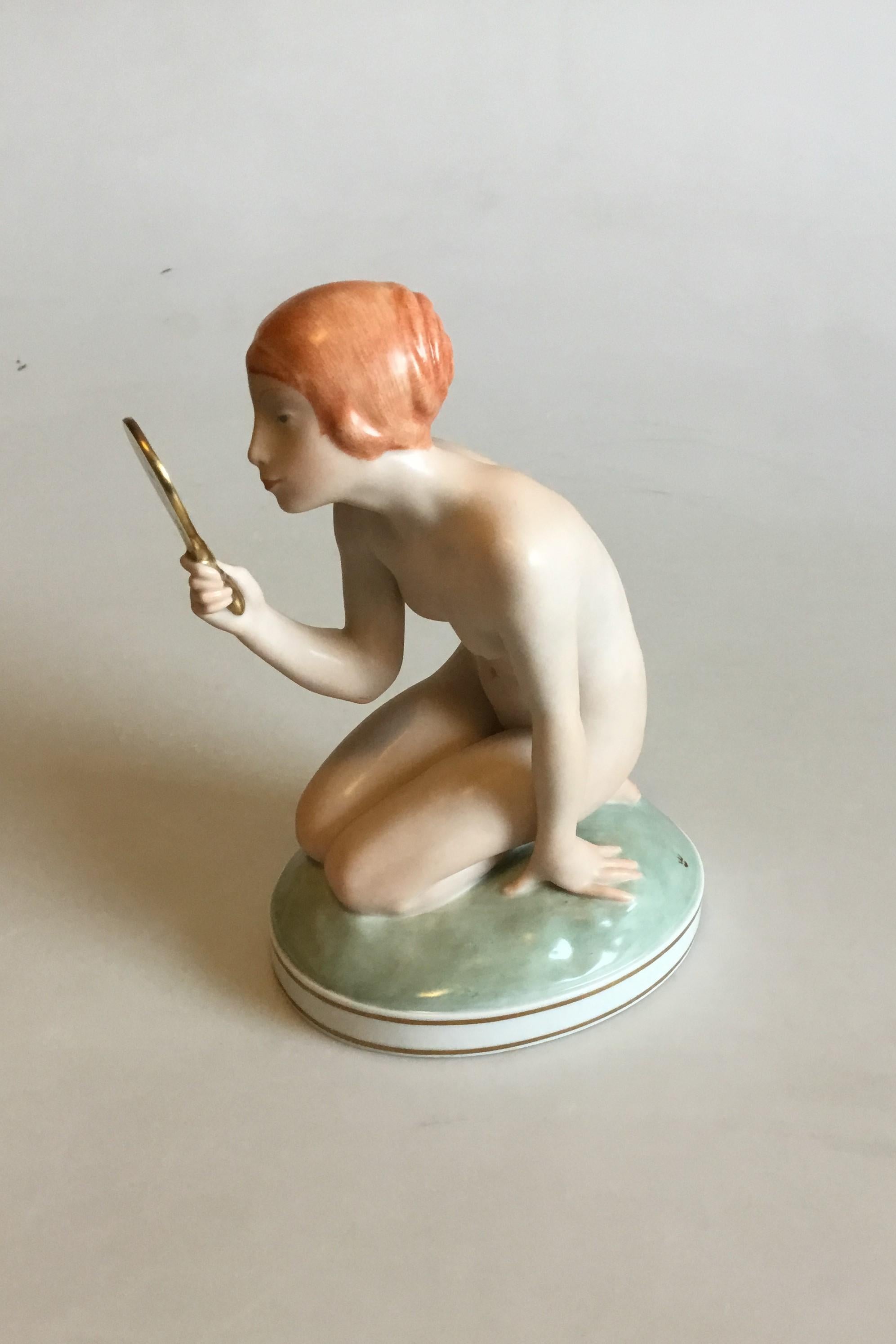 Royal Copenhagen Figurine of girl with mirror No 1244. Designed by Gerhard Henning. Dated 1920-4-24. 1st quality. Measures: 18 cm 7 3/32 in.
Perfect condition.