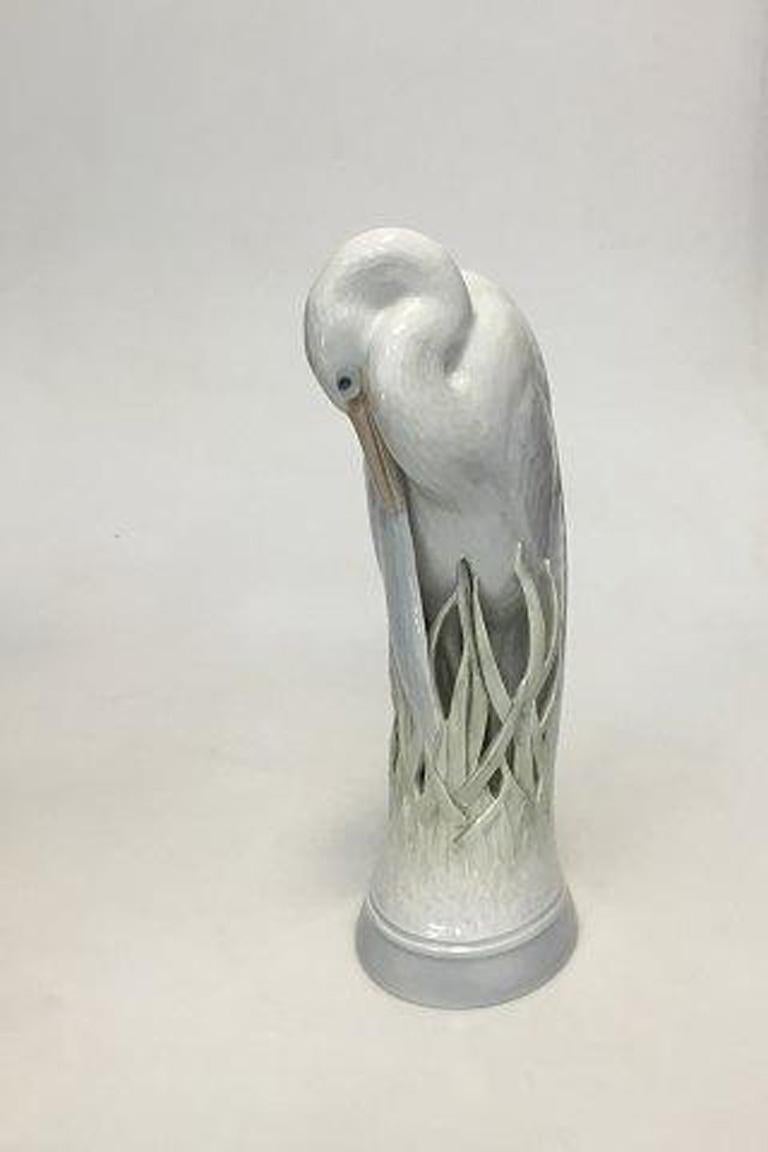 Royal Copenhagen figurine of heron no 3002. Designed by Theodor Madsen. 

Measures 26 cm / 10 15/64 in. 2nd Quality.
 