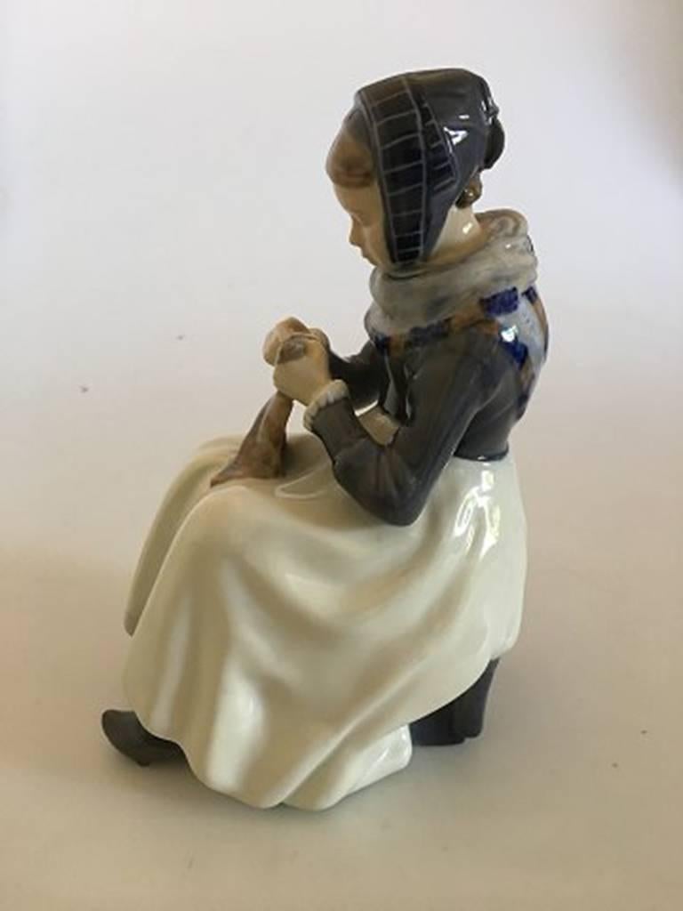 Royal Copenhagen figurine of woman with cloth no. 1317. Measures: 22 cm H. Marked as a Third. In nice whole condition.