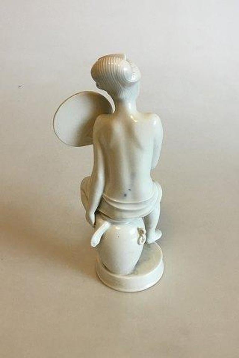 Royal Copenhagen figurine of woman with fan no 12486.

Designed by Bode Willumsen. 

Measures 23 cm / 9 1/16 in.
  