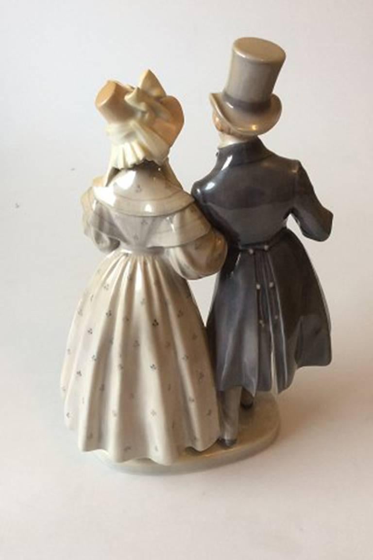Royal Copenhagen figurine Victorian couple #1593. Measures 29 cm and is in good condition. Designed by Christian Thomsen.