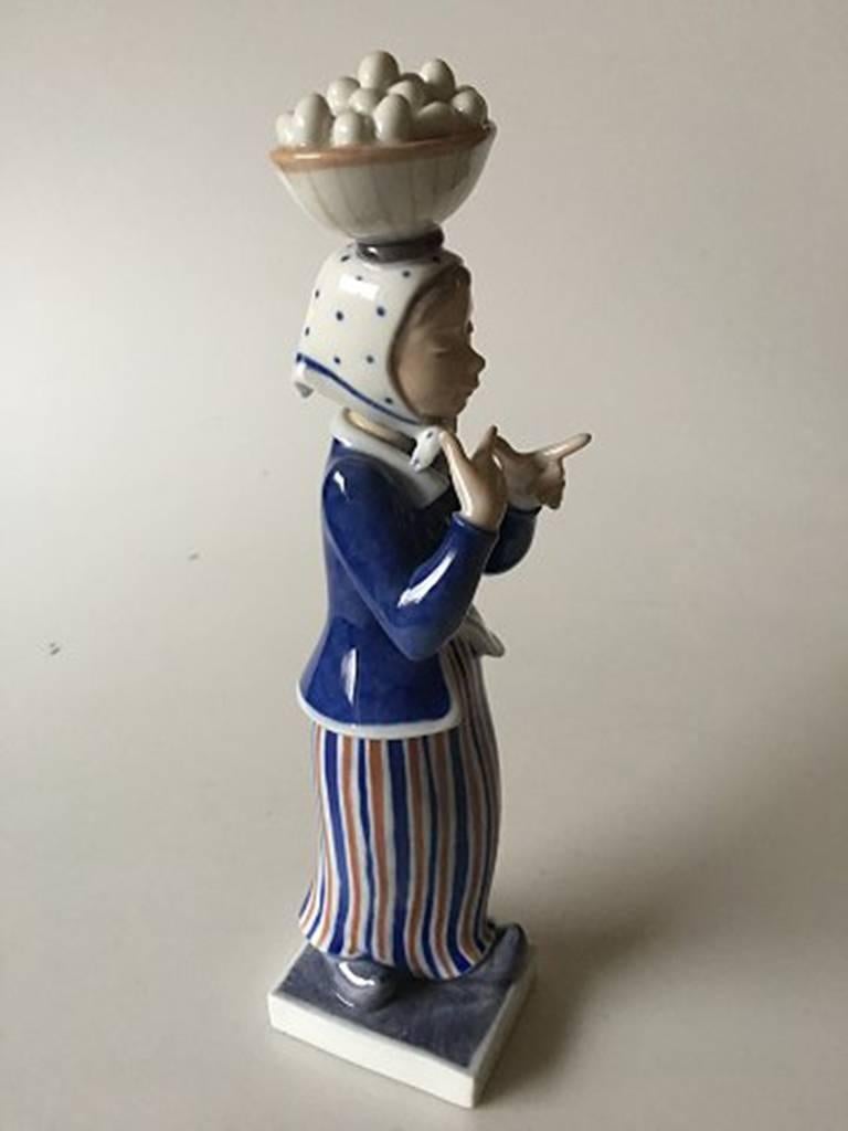 Royal Copenhagen figurine woman with eggs by Johannes Hedegaard #4418. Measures: 31cm / 12 1/5 inches.