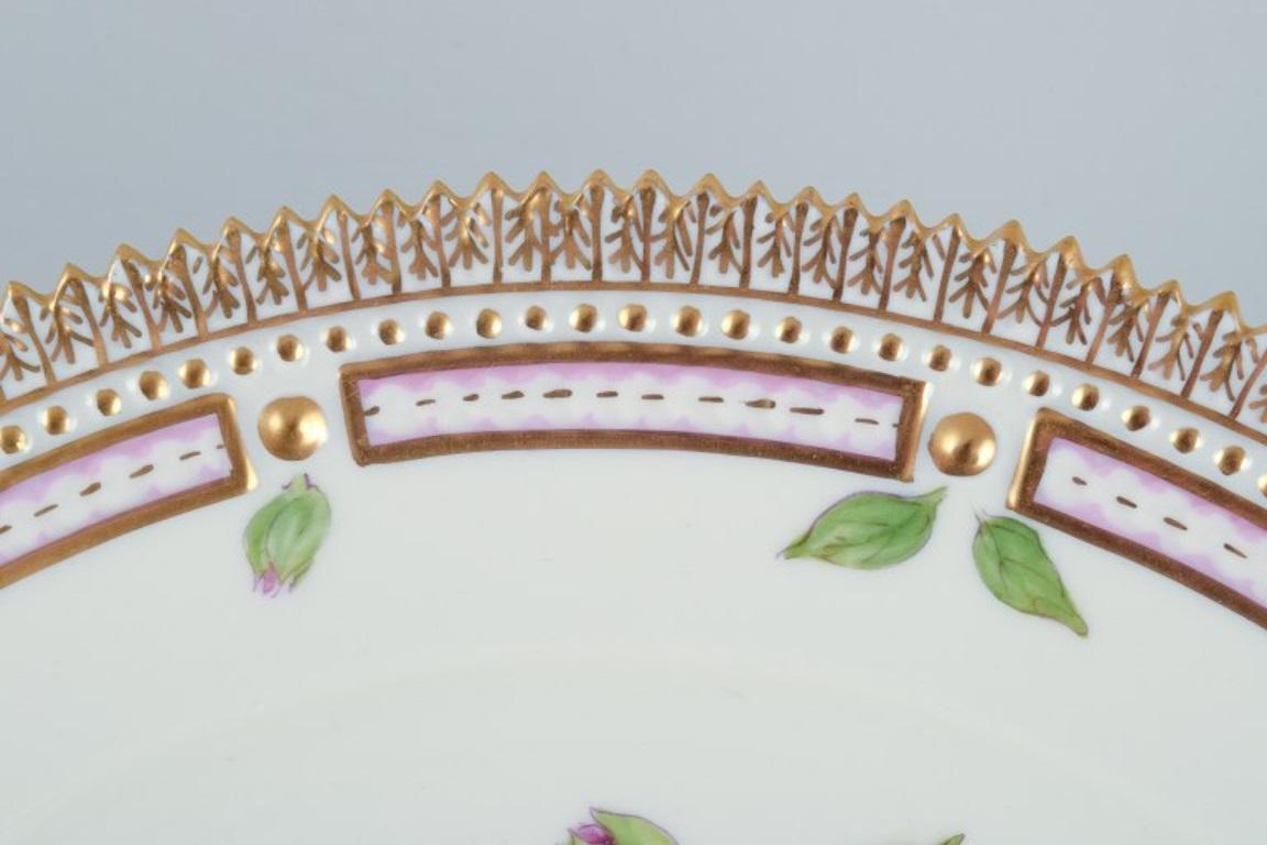 Danish Royal Copenhagen Flora Danica dinner plate. 24 karat gold leaf decoration.
