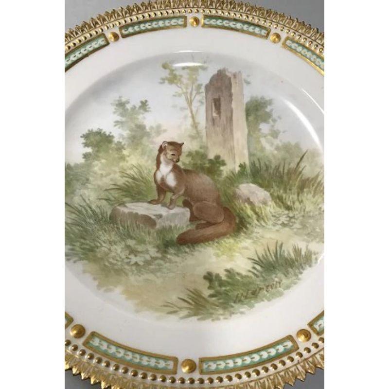 Royal Copenhagen Flora Danica/Fauna Danica animal luncheon plate No 240/3550 

Measures 22 cm(8 21/32 in) 

Latin Name: Mustela foina

Signed by H. Larsen 

From 1893-1900.