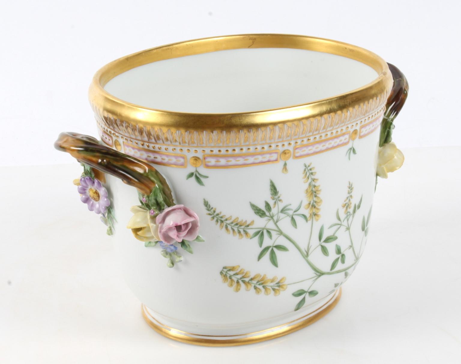 Royal Copenhagen Flora Danica oval wine cooler #3569.
Measures: 27 cm x 16.5 cm (10 3/5 inches x 6 1/2 inches)
Repair on one handle and minor damage on one rose and flower.