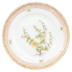 Royal Copenhagen. Flora Danica porcelain side plate with botanical motif.