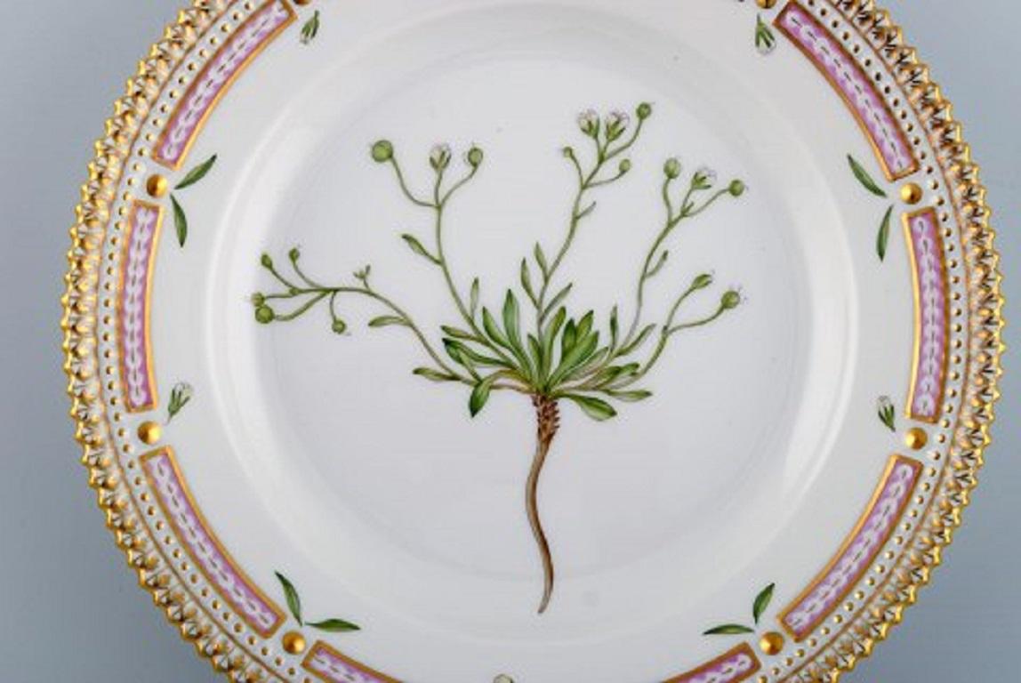 Royal Copenhagen Flora Danica salad plate in hand painted porcelain with flowers and gold decoration. 
Model number 20/3573.
Measures: Diameter 19.5 cm.
In perfect condition.
1st factory quality.
Stamped.