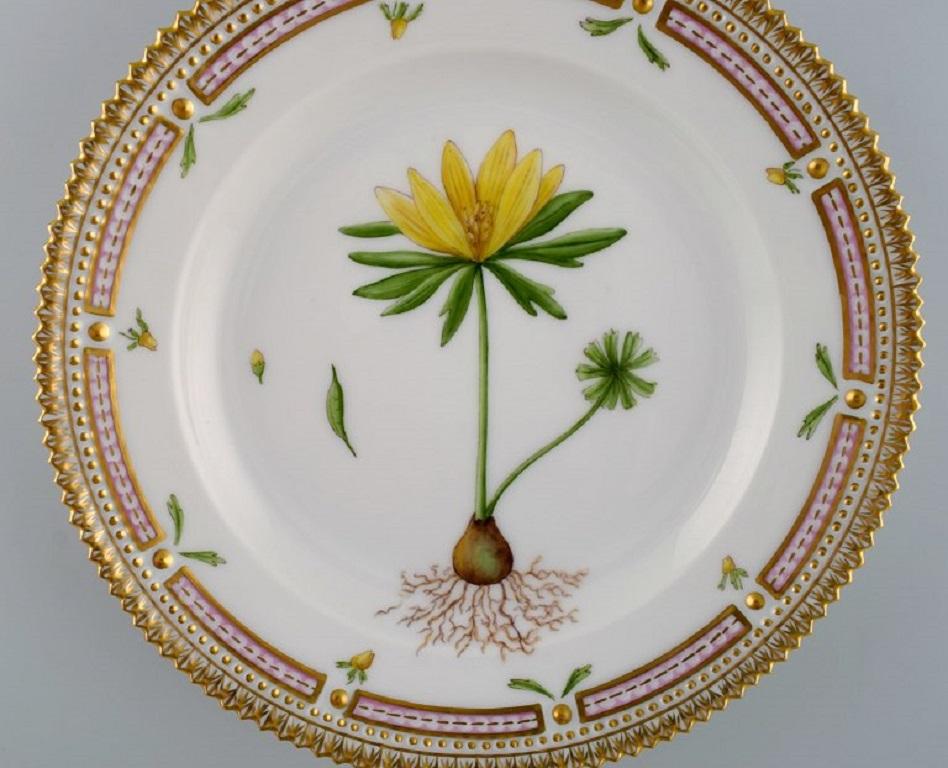 Royal Copenhagen Flora Danica salad plate in hand-painted porcelain with flowers and gold decoration. 
Model number 20/3573.
Diameter: 19.5 cm.
In perfect condition.
1st Factory quality.
Stamped.
