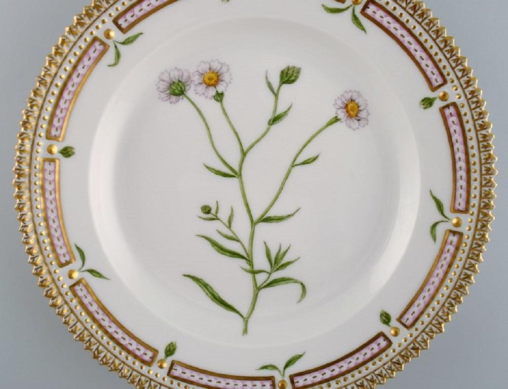 Royal Copenhagen Flora Danica salad plate in hand-painted porcelain with flowers and gold decoration. 
Model number 20/3573.
Diameter: 19.5 cm.
In perfect condition.
1st factory quality.
Stamped.