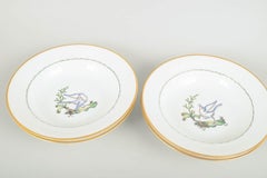 Royal Copenhagen. Four large deep porcelain plates with bird motif. Early 20th C