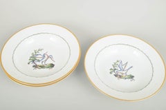 Royal Copenhagen. Four large deep porcelain plates with bird motif. Early 20th C