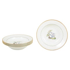 Royal Copenhagen. Four large deep porcelain plates with bird motif. Early 20th C