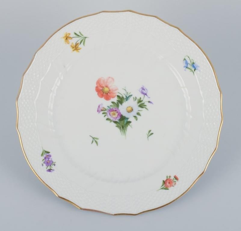Hand-Painted Royal Copenhagen, four Saxon Flower dinner plates in porcelain. For Sale