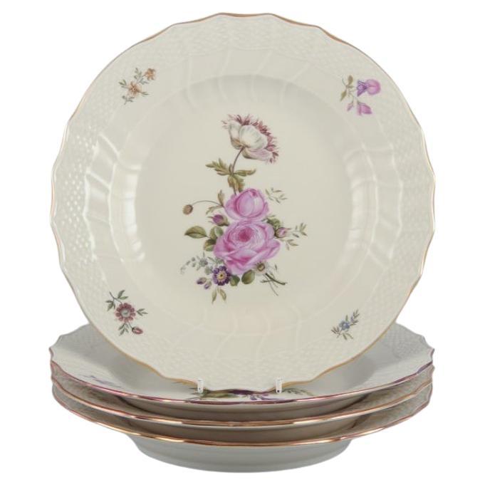 Royal Copenhagen "Frijsenborg". Four dinner plates in hand-painted porcelain.