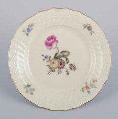 Royal Copenhagen, "Frijsenborg". Thirteen plates in hand-painted porcelain.