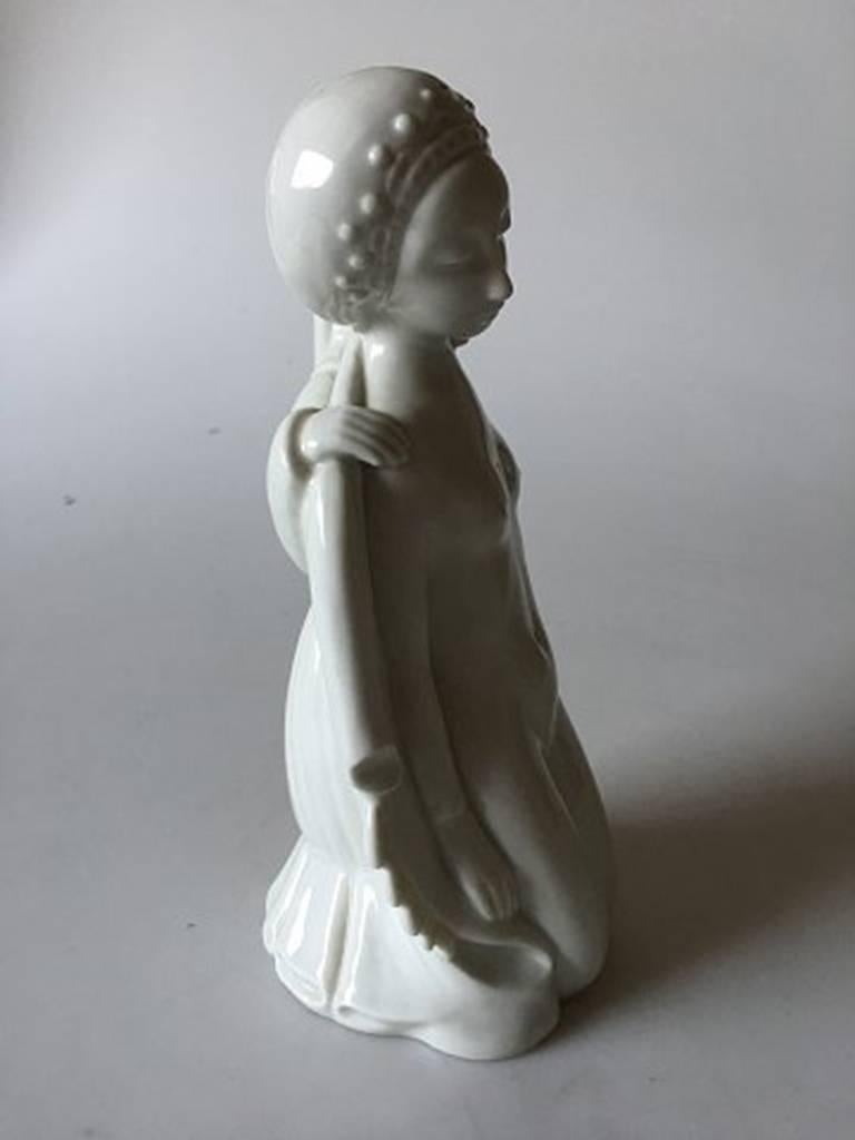 Royal Copenhagen Georg Thylstrup figurine #1760. In blanc de chine glaze, measures 19.5cm and is in perfect condition.