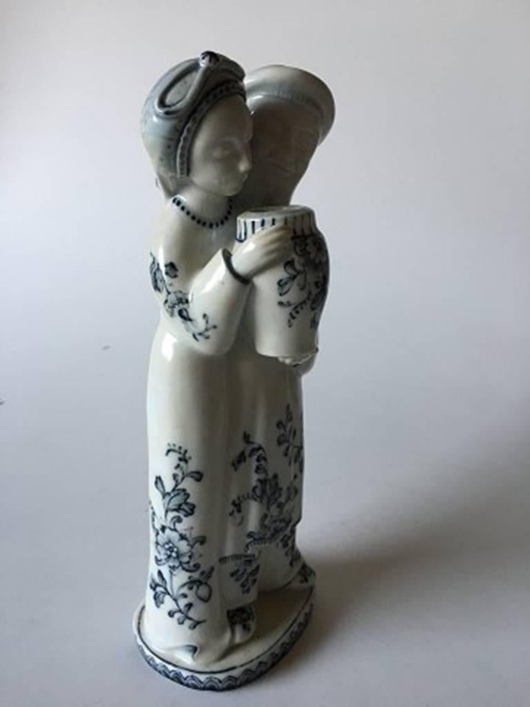 Royal Copenhagen Georg Thylstrup figurine of man and woman #1618. Measures 25cm and is in good condition.