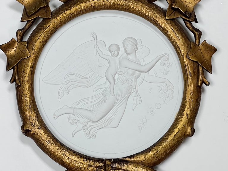 A pair of large porcelain plaques in their original carved gilt frames. Marked on verso, date to late 19th century. Plaques without the frames are 10.5” in diameter.