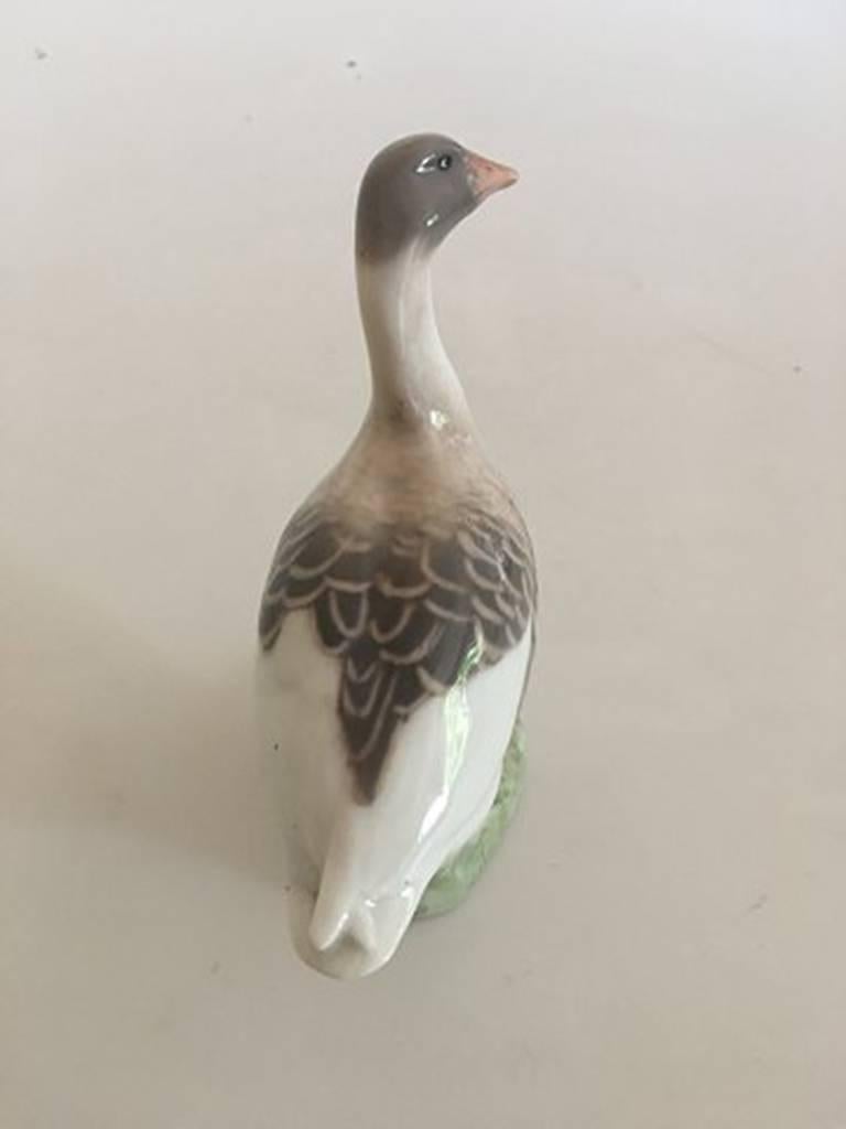 Royal Copenhagen goose figurine no. 1400/1088. First quality. In nice whole condition. From around 1889-1922. Measures: About 12 cm high (4 23/32 in).