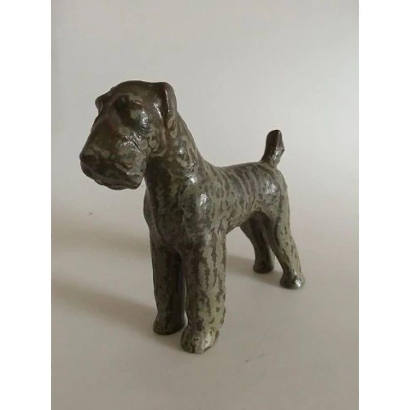Royal Copenhagen Gudrun Lauesen Airedale Terrier Figurine.

Measures 20.5 cm and 22 cm wide. In perfect condition.
