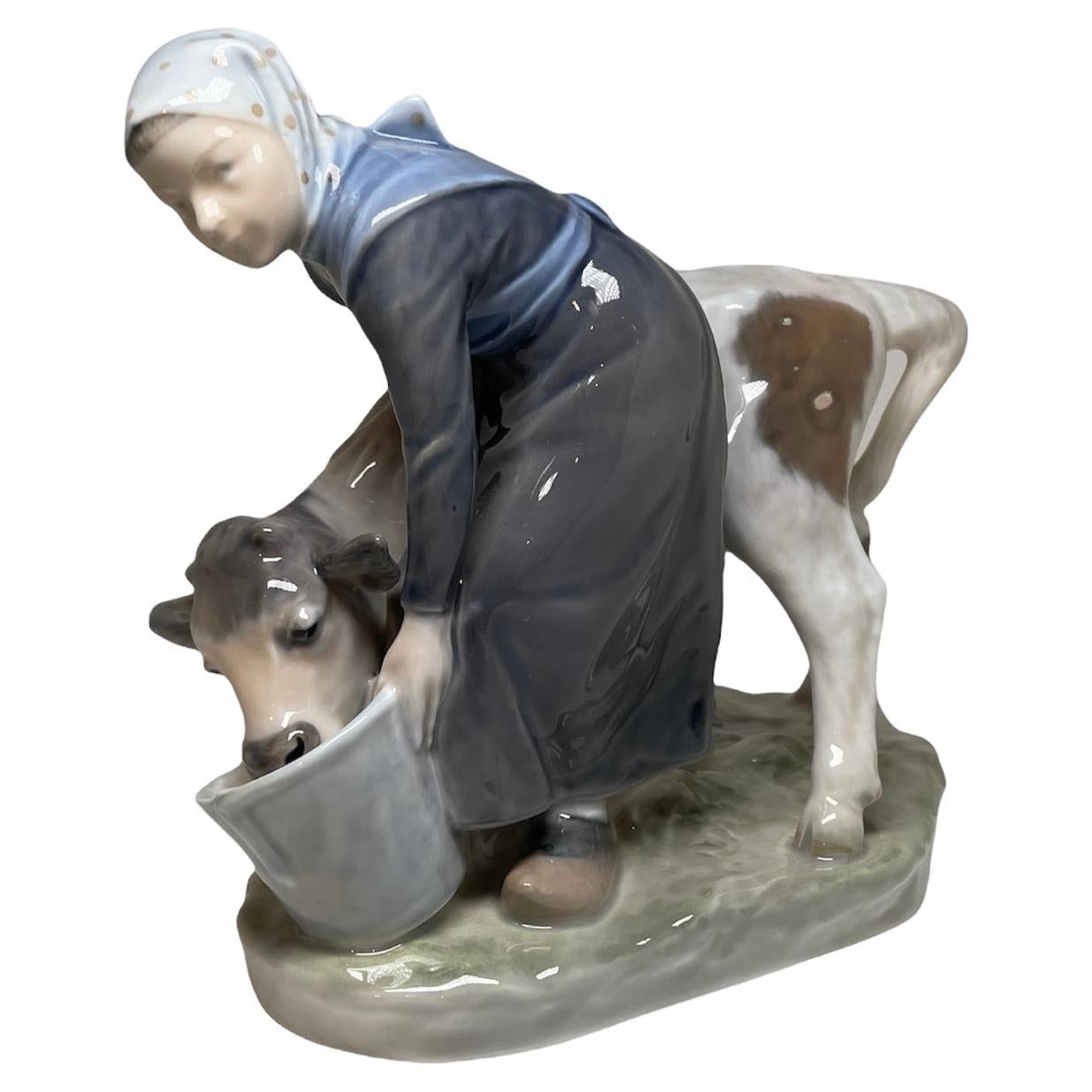 Royal Copenhagen Hand Painted Porcelain Young Girl Peasant Feeding a Calf For Sale
