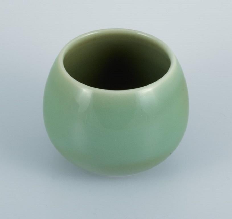 Royal Copenhagen jar / vase in glazed stoneware. 
Beautiful celadon glaze. Danish design.
Mid-20th Century
Marked.
In excellent condition.
First factory quality.
Measures: 14,0 x 11,0 cm.