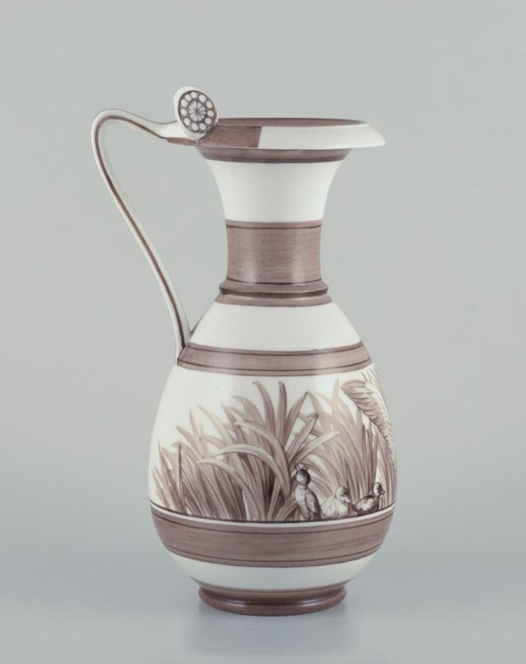 Royal Copenhagen. Large and rare antique pitcher.
Overglaze. Unique work.
Decorated with a motif of a duck family.
Historicism.
From the 1870s.
Perfect condition.
Marked.
First factory quality.
Dimensions: H 31.5 cm x W 19.0 cm.