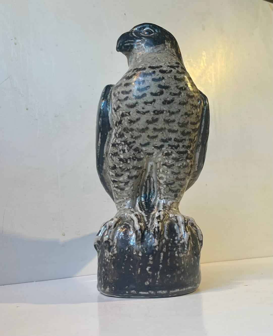 Large glazed stoneware Falcon designed by the Danish ceramist Knud Kyhn (KK) all the way back in 1940-50. Hugely inspired by the sung glazes applied in Axel Salto's and Bode Willumsen's designs these naturalistic figurines were very popular. This